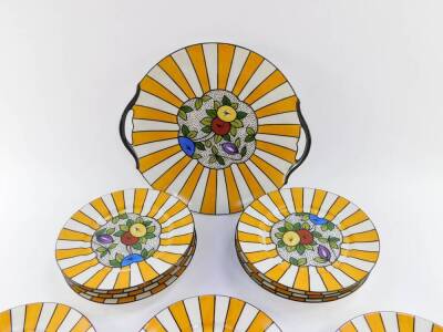 A Limoges early 20thC porcelain sandwich set, decorated with fruit within a sunburst border, printed mark, comprising twin handled dish and twelve plates. - 2