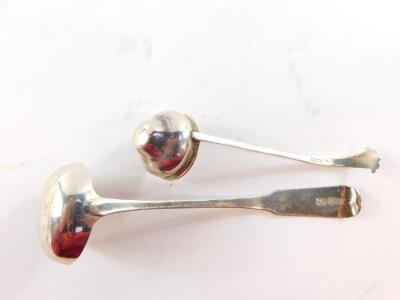 A George III Scottish silver cream ladle, initial engraved, John Zeigler, Edinburgh, 1815., and a George V silver cream ladle, with an ogee shaped bowl, Thomas Bradbury & Sons Ltd, Sheffield 1923, 1.24oz. (2) - 4