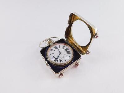 An Edward VII silver Goliath pocket watch clock case, of square section with C scroll loop handle, raised on bun feet, containing a plated Goliath pocket watch, Walker & Hall, Sheffield 1910, 10.5cm high, 8cm wide. - 4