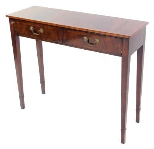 A Georgian style mahogany and cross banded side table, with two frieze drawers, raised on tapering square legs, 76.5cm high, 92cm wide, 31cm deep.