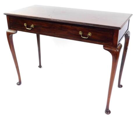 A Georgian style mahogany serving table, with single frieze drawer, raised on cabriole legs, 84cm high, 114cm wide, 52cm deep.