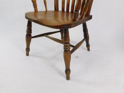 A Victorian beech oak and elm lath back kitchen chair, with solid saddle seat, raised on turned legs, united by an H frame stretcher. - 4