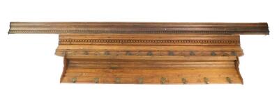 A late 19thC oak wall hanging coat rack, 151cm wide., another similar, 182cm wide., and a wall mounted plate rack, 285cm wide. (3) - 2