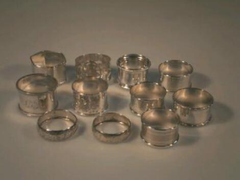 A collection of eleven assorted silver napkin rings