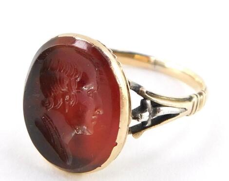 A Victorian Carnelian ring, intaglio carved with the bust portrait of a gentleman, set in yellow metal, size L, 2.7g.