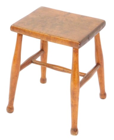 An Arts & Crafts pale oak stool, raised on turned legs, united by an H frame stretcher.