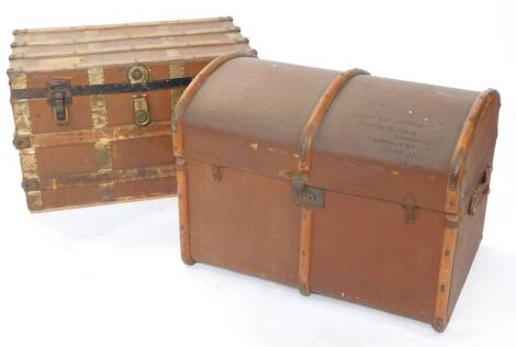 An early 20thC canvas cabin trunk, plywood and metal bound, with double leather strap handles, bears luggage labels, 49cm high, 77cm wide, 52cm deep, together with a domed canvas and plywood trunk, 87cm high, 78cm wide, 52cm deep. (2)