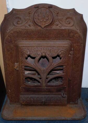 A Columbian Stove Works late 19thC cast iron Mutesse stove, cast with flowers and foliate scrolls, the rectangular pierced central door opening to reveal a fitted interior above an ashes tray, raised on a curved grate, 79cm high, 60cm wide, 34cm deep.