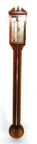 A mahogany and line inlaid stick barometer by Comitti of Holborn, with thermometer and vernier scale, the case of architectural form, 99cm high.