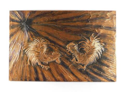 A copper high relief picture of two fighting cocks, engraved mark, 53.5cm high, 82cm wide.