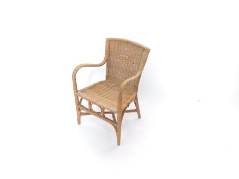 An early 20thC wicker child's carver chair.