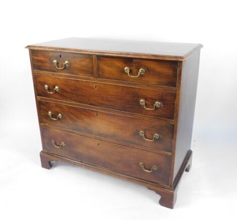 A George III mahogany chest, of two short over three long graduated drawers, raised on bracket feet, 98cm high, 110cm wide, 53cm deep.