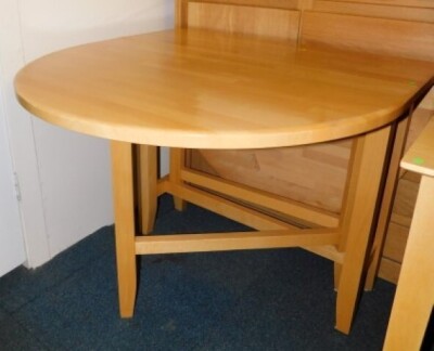 A beech drop leaf table, 75cm high, 37cm wide, 146cm extended, 93cm deep.