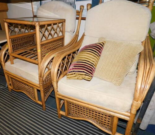 A pair of bamboo and cane conservatory armchairs, together with a matching coffee table and a folding table. (4)