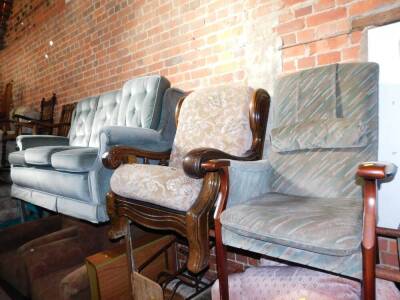 A green velour three seater sofa, oak framed armchair and another armchair. (3) The upholstery in this lot does not comply with the 1988 (Fire & Fire Furnishing) Regulations, unless sold to a known exporter or upholsterer it will be cut from the frame bef