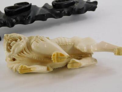 A 19thC oriental carved ivory figure of a prowling lion, (AF), 16cm long, on contemporary hardwood stand. - 3