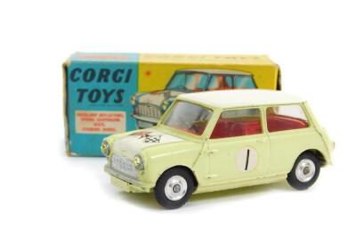 A Corgi die cast model of a Morris Mini Cooper, Competition Model, in white and pale green, with Glidamatic spring suspension, No 227, boxed.