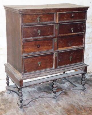 An 18thC oak chest on stand, 121cm high, 96cm wide, 54cm deep. (AF)