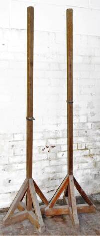 A pair of square stanchions, with support brackets, 221cm high.