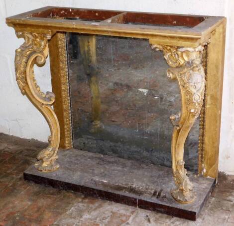 A Georgian gilt wood and gesso pier table, with mirror back and C scroll cabriole forelegs with cartouche knees, 93cm high, 100cm wide, 41cm deep.