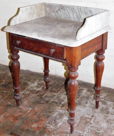 A Victorian mahogany wash stand, with marble top, frieze drawer with knob handles and turned legs, 76cm high, 72cm wide, 54cm deep.