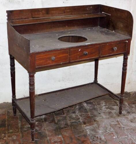 A Georgian mahogany tray top washstand, with central bowl recess and two frieze drawers on turned legs with undershelf, 92cm wide.