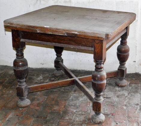 An oak draw leaf dining table, 90cm x 90cm with an additional 66cm provided by the leaves. (AF)