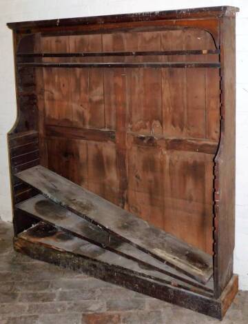 An early 19thC mahogany waterfall open bookcase, 166cm high, 155cm wide, 30cm deep.