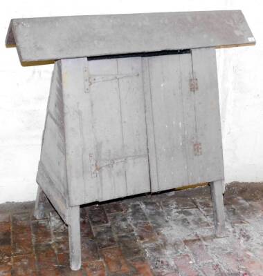 An early 19thC painted saddle rack and equestrian cupboard, of A frame form, 114cm high, 125cm long.