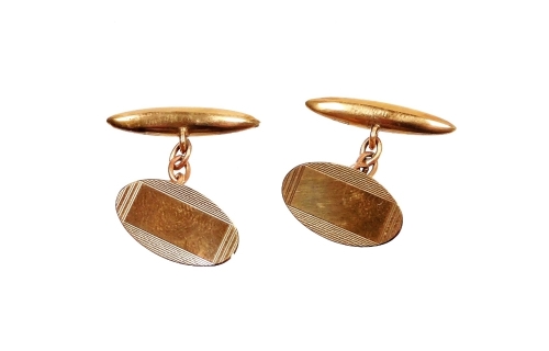 A pair of 9ct gold cufflinks, of oval turned decoration, makers stamp HG and S, 3g all in, boxed.