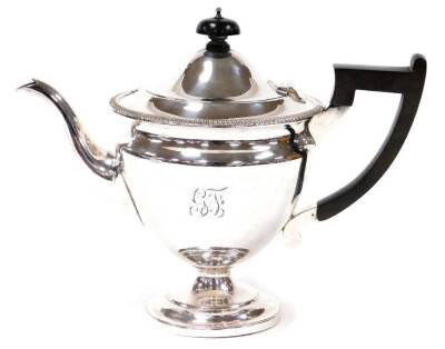 A late 19thC silver plated three piece tea service, comprising tea pot, milk jug and sugar bowl, the teapot with an ebony knop and handle, on a fluted baluster stem, makers stamp MH & Co, each piece by W Mantle and company, and bearing the initials CF, th - 2