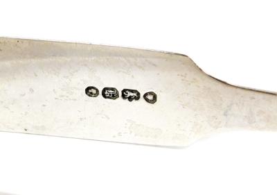 Two pairs of silver sugar tongs, one of plain design bearing the initials TMJ, London 1833 and another pair with shell cartouche decoration, London assay, 3½oz. (2) - 2