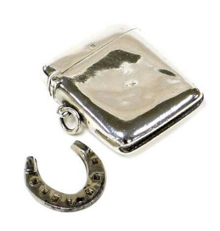 A George VI silver vesta case, of plain design with single loop attachment, makers stamp A&J, Birmingham 1944, 1¼ oz.