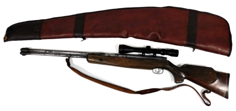 A Weihrach .22 under lever air rifle with 3-9 x 40 telescopic sights, 114cm long, with leather slip case.