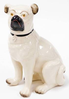 A Staffordshire type figure of a seated pug, 28cm high.