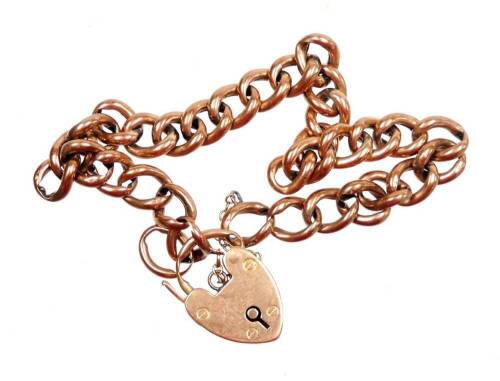 A 9ct rose gold charm bracelet, with curb link rose gold bracelet, with a heart shaped padlock with makers stamp WG&S, Birmingham 1908, with safety chain, approximately 20cm long, 9.7g.