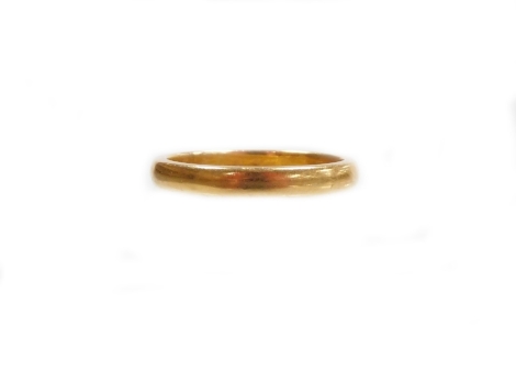 A 22ct gold wedding band, of plain design, makers stamp T.R.W and S, Birmingham 1986, ring size J½, 3.3g.