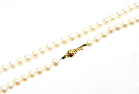 A freshwater pearl beaded necklace, with a 9ct gold ball clasp, 60cm long overall, 28g all in, boxed.