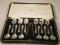 A cased set of twelve silver coffee spoon and sugar nips. Sheffield assay