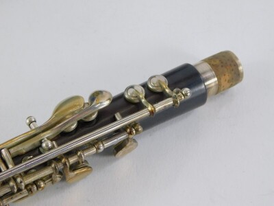 A Rudall Carte and Co Limited rosewood piccolo, impressed indistinctly for Oxford Street, London, number 5357, with silver plated mounts in a later fitted case. - 3