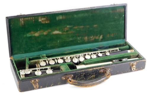 A turned ebony and plated flute, with Bakelite and metal head, unmarked, in fitted case.