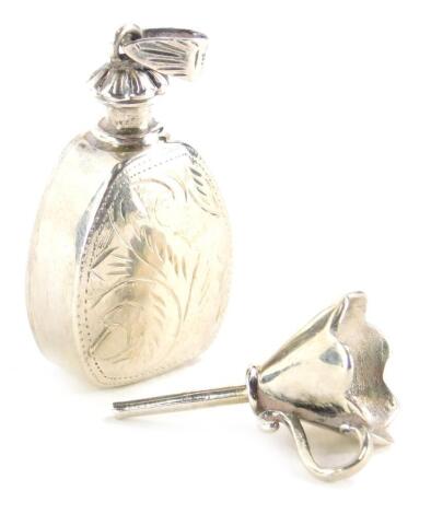 A white metal scent bottle and funnel, with etched decoration of scrolls, etc., the scent bottle marked 925, ¼oz. (2)