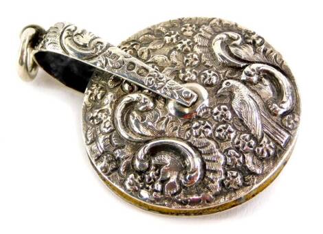 A Victorian silver pin wheel, repousse decorated with bird, flowers, scrolls, etc., by S Mordan and Co. Ltd.