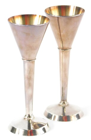 Two Danish white metal small goblets, by Frans Hingelberg, of tapering form, marked to base 925s, 12cm high, (AF).