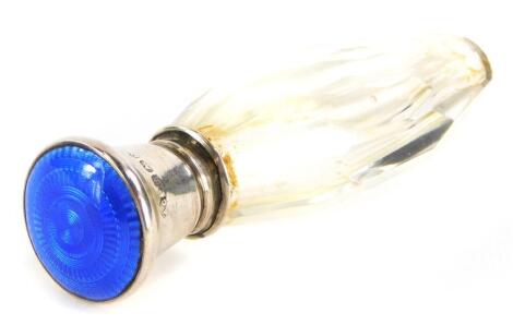 A George V silver topped scent bottle, with engine turned enamel blue stopper, Birmingham 1924, 6cm long.