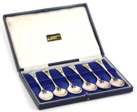 A set of six Elizabeth II teaspoons, with floral enamel decoration, Birmingham 1965, 2¾oz, in a fitted box.