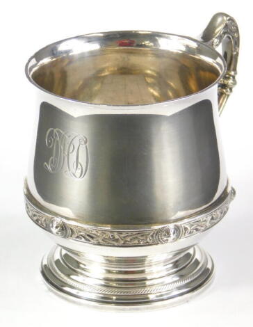 A George V silver cup, by Adie Brothers, of compressed bell shaped form, angular handle, inverted stem and circular foot, marked Finnigans Limited, Birmingham 1934, 8cm high, 4.8oz.