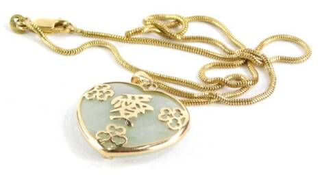 A Chinese jade heart shaped pendant, in a yellow metal 9ct gold frame, on an articulated necklace.