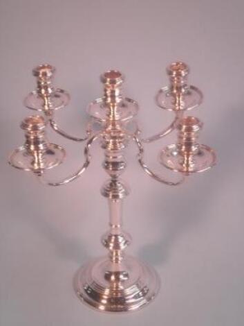 An Elizabeth II silver five light candelabrum of 18thC design by Richard Comyns