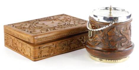 A carved hardwood cigarette or cigar box, decorated with grapes and vines, 18cm x 25cm, and a carved oak biscuit barrel with silver plated mounts, dated 1896. (2)